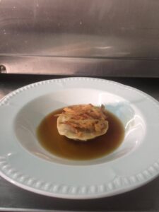 Rabbit Ravioli with game consomme