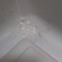 Badly cracked shower tray