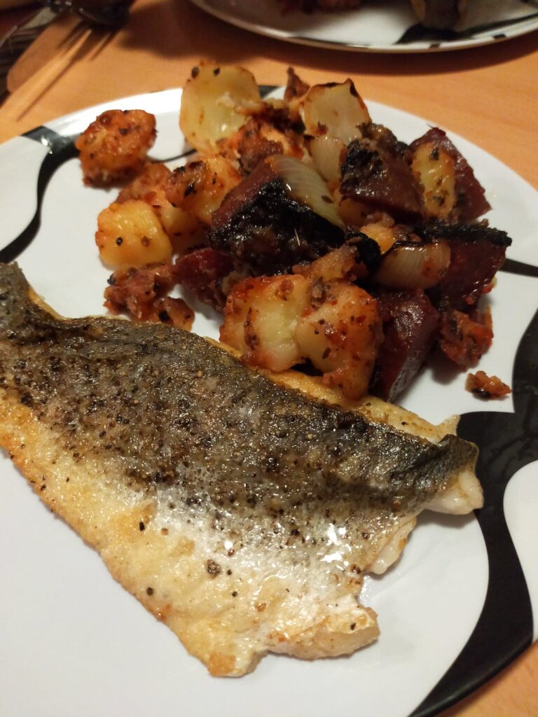 lockdown cooking - Pan fried sea bass with roast beetroot, onion and potato flavoured with cumin and lemon. Accompanied by a harissa yoghurt.