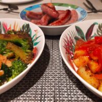 Spanish sausages, patatas bravas, and broccoli tapas
