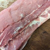 Preparing pork loin for making bacon