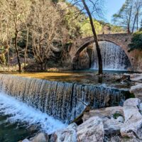 Stone bridge and waterfall of Palaiokarya, Greece