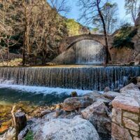 Stone bridge and waterfall of Palaiokarya, Greece