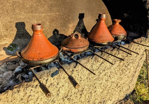 Tagines cooking over charcoal